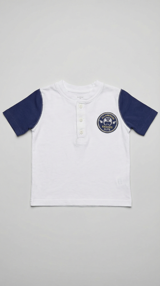 White henley shirt with navy blue raglan sleeves and All American Racers Elite logo patch, size 2T